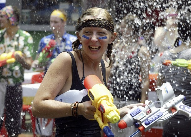 tourist participates in water gun fight during songkran festival celebration in bangkok